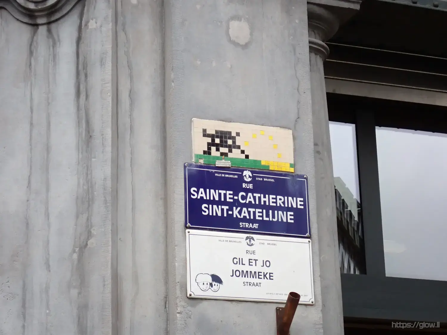 Photo of a plaque featuring a peeing space invader