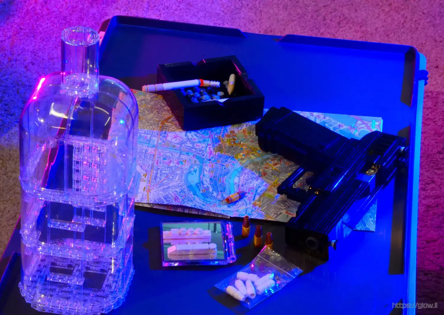 Small Table with a gun, drugs, ashtray and a bottle all made of Lego